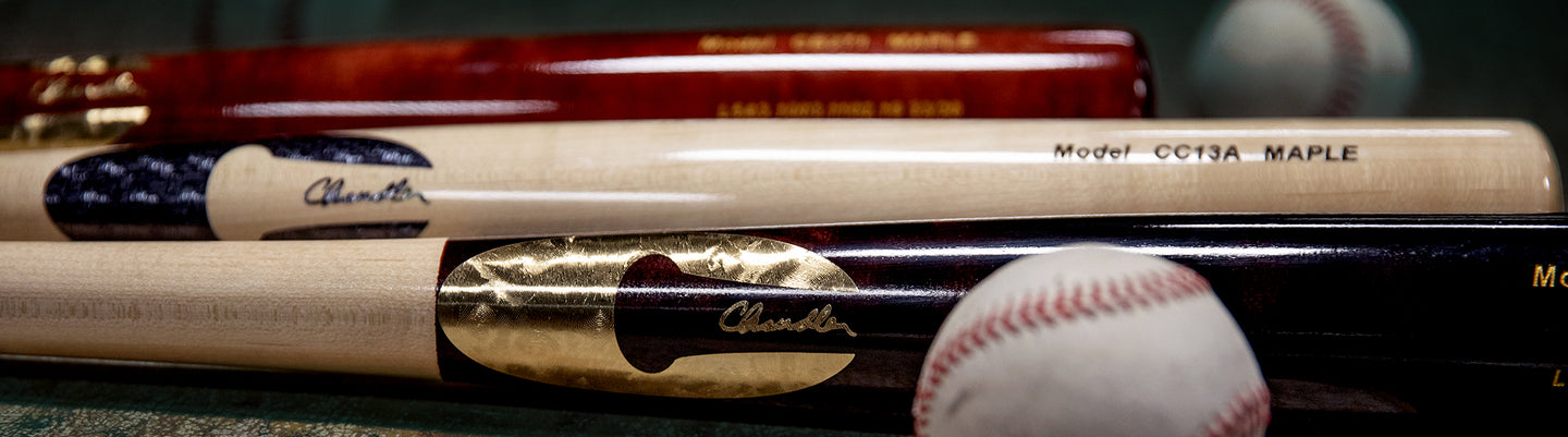 Chandler bats lined up, with baseballs